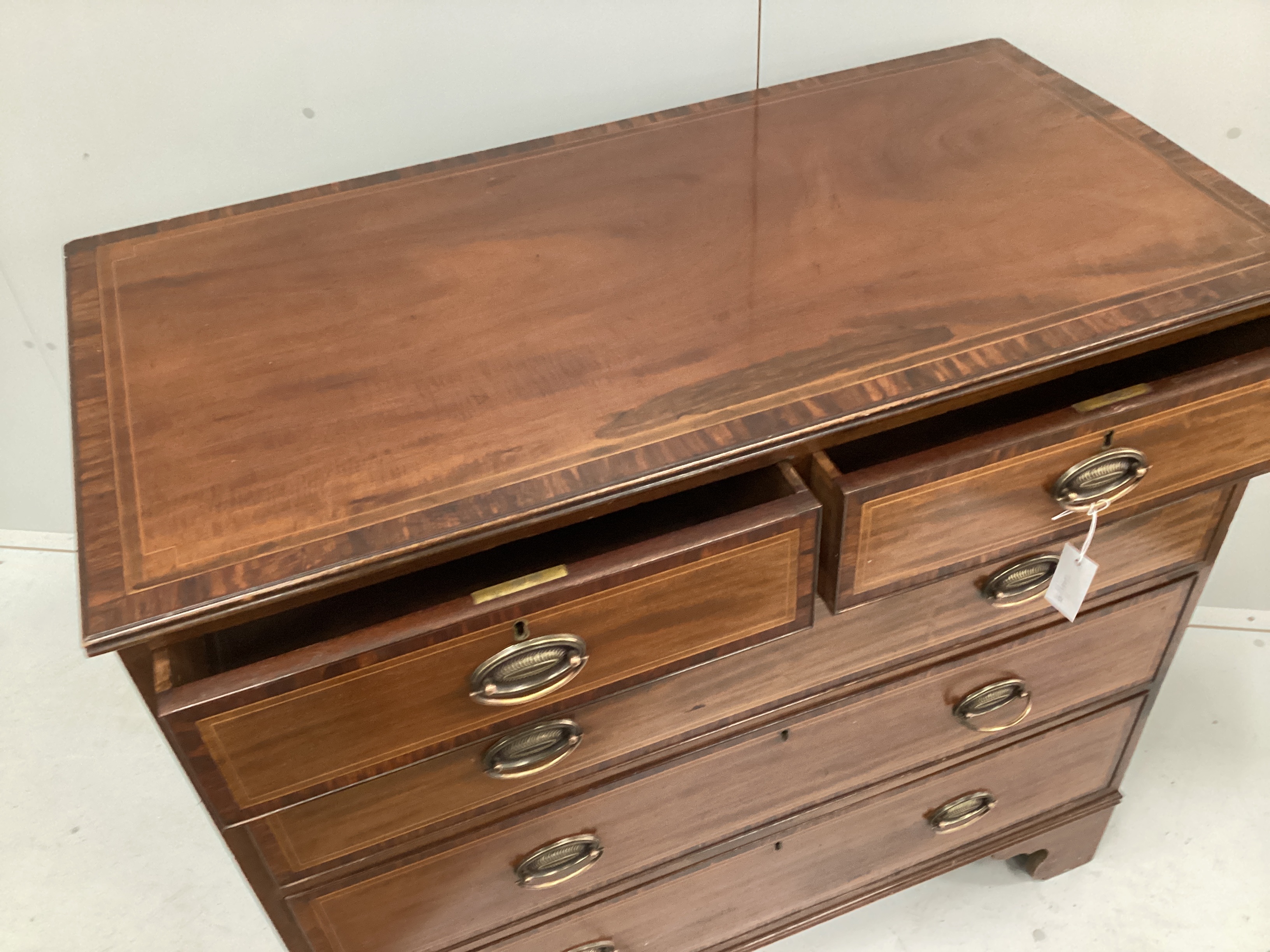 A George III style banded mahogany five drawer chest stamped Edwards and Roberts, width 106cm, depth 54cm, height 102cm